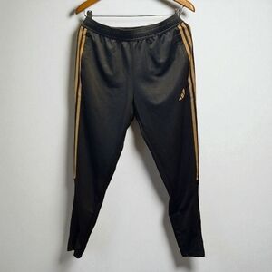 Adidas Women's Black Joggers with Gold Stripes